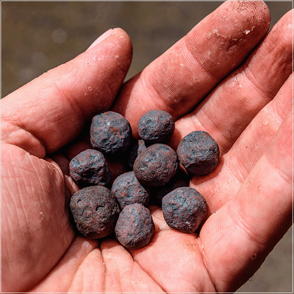 A avaliação do aumento de volume das pelotas de minério de ferro